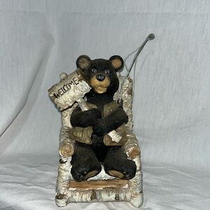 Bear sitting on chair fishing vest fishing pole holding welcome sign figurine